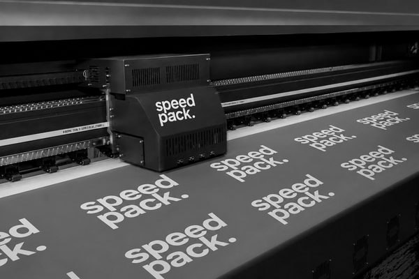 Wide-format printer laying a repeating Speedpack pattern onto sheet